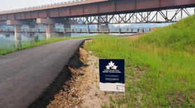 River Valley Alliance Pedestrain Bridge and a Trans Canada Trail sign