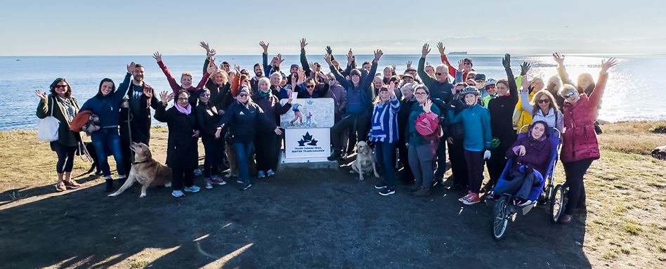 Melanie Vogel and trail members at the Point Zero marker on the Trans Canada Trail in Victoria, BC