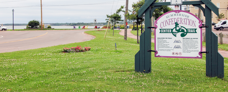 Summerside's Confederation Trail signpost - marking the entrance to a picturesque pathway | Panneau indicateur du Sentier de la Confédération de Summerside – marquant l'entrée d'un sentier pittoresque. 