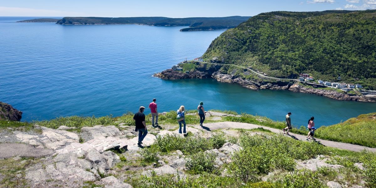 People walk on the East Coast Trail in St. John's, Newfoundland.