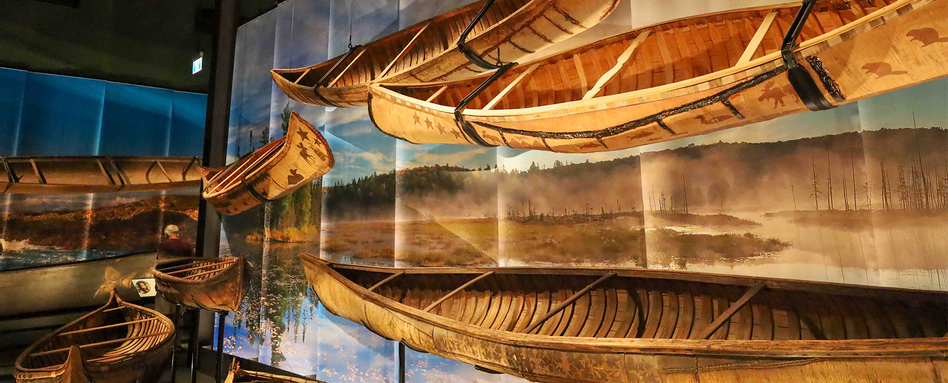 canoes hanging in museum