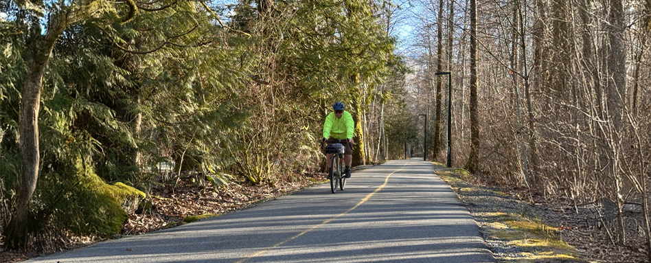man on a cycle path on a bike 