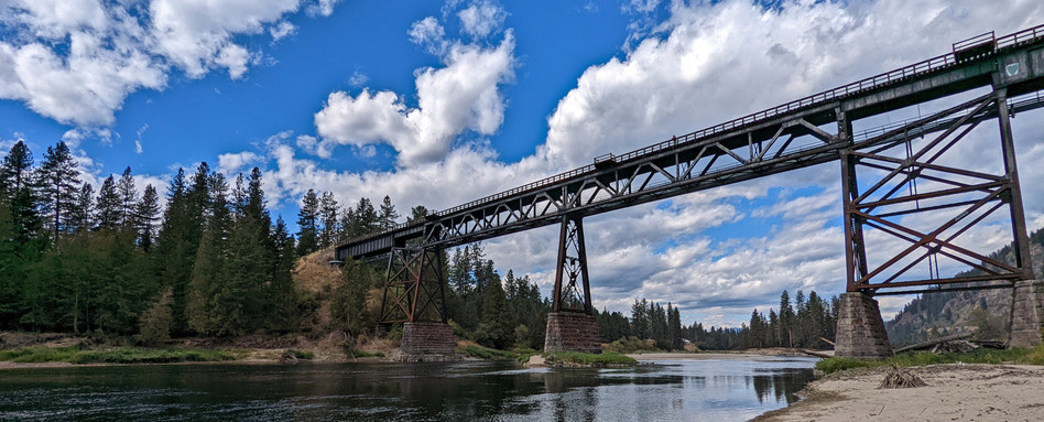 03Trestle from below_support image_credit Off Track Travel | Sentier Transcanadien long bridge over water and blue sky