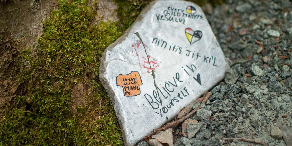 photo of stone with writing
