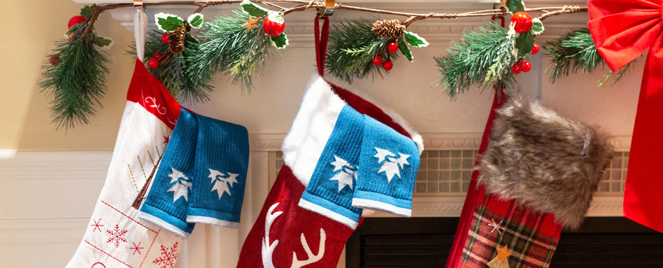socks hanging out of a stocking on a banner