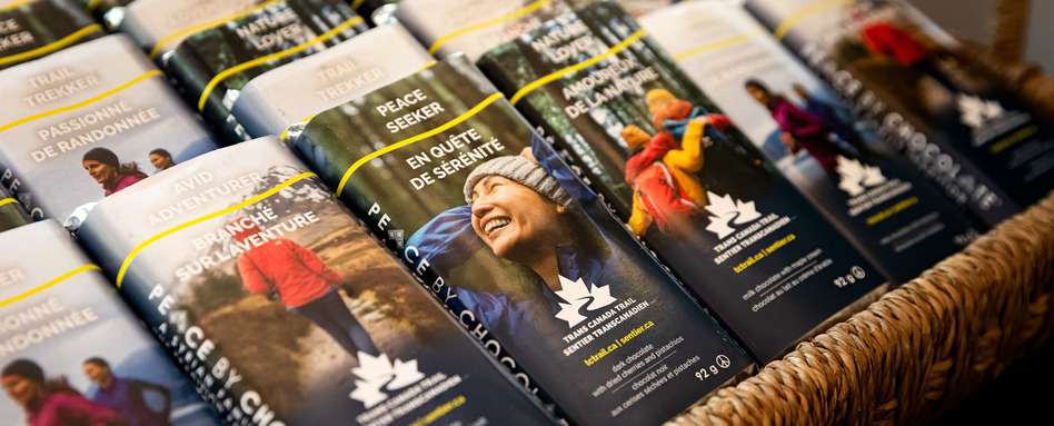 chocolate bars with people smiling in the outdoors on labels