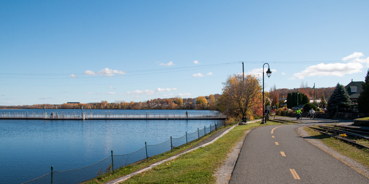 QC - La Montérégiade - Granby | Sentier Transcanadien long bike pathway alongside waterfront trees