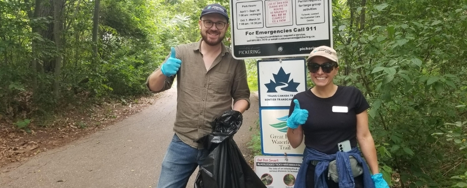 two people posing infront of trail signage