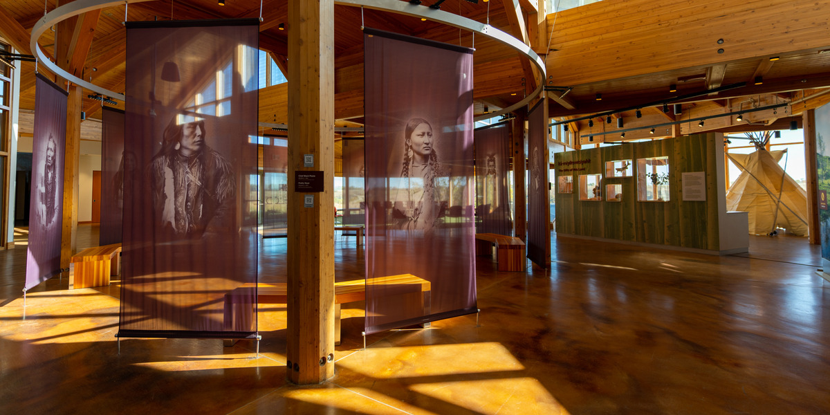 museum featuring indigenous faces and exposed wood