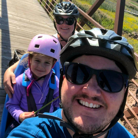 family of three taking a selfie
