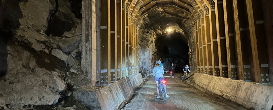 large tunnel with cyclists inside