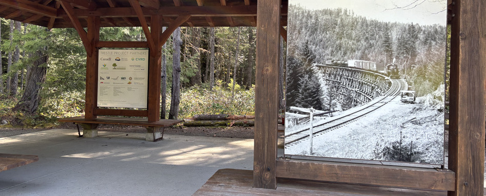 trail signage under covered wooden area